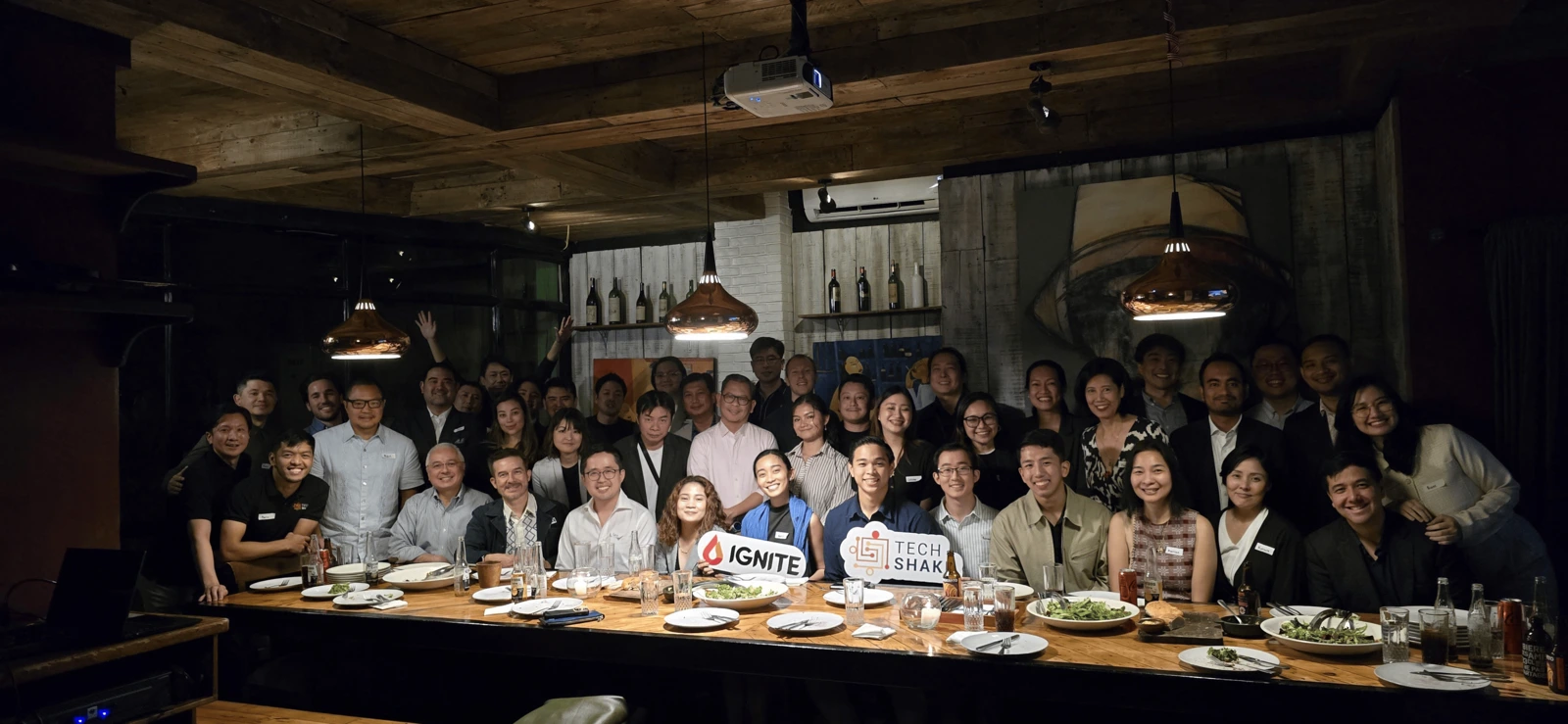 Guests gathered around the table at a TechShake Innovators' Dinner