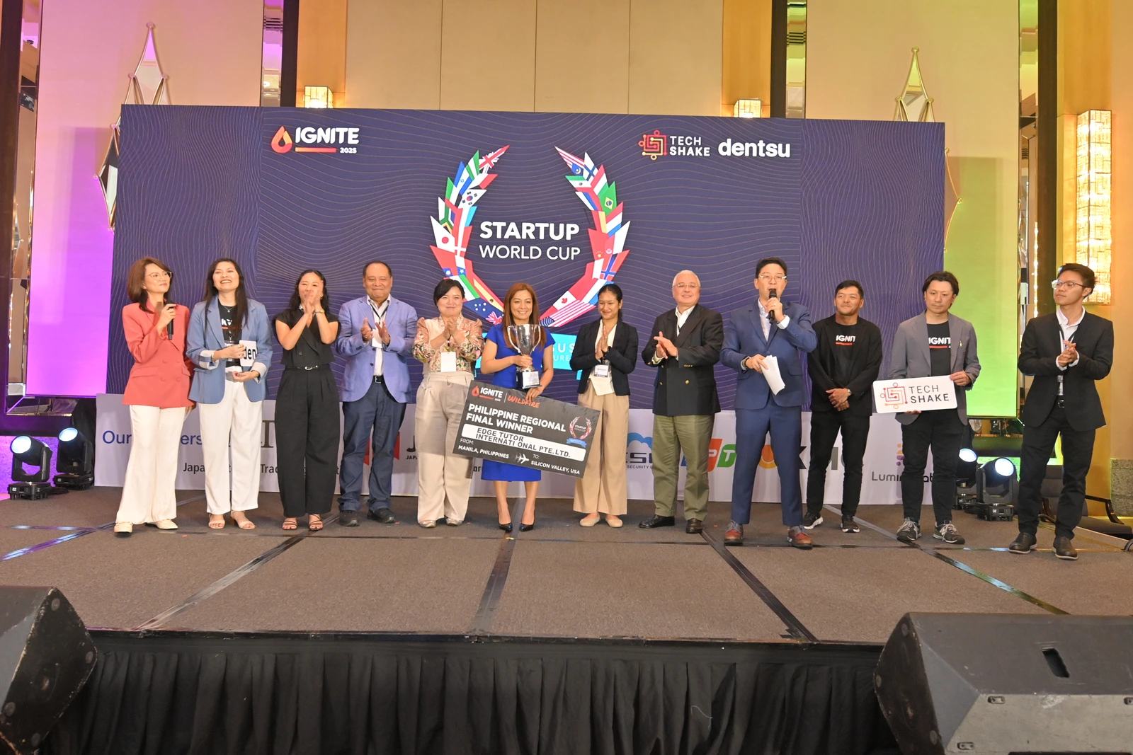 Winners and organisers on stage at the Startup World Cup Philippine Regional Final